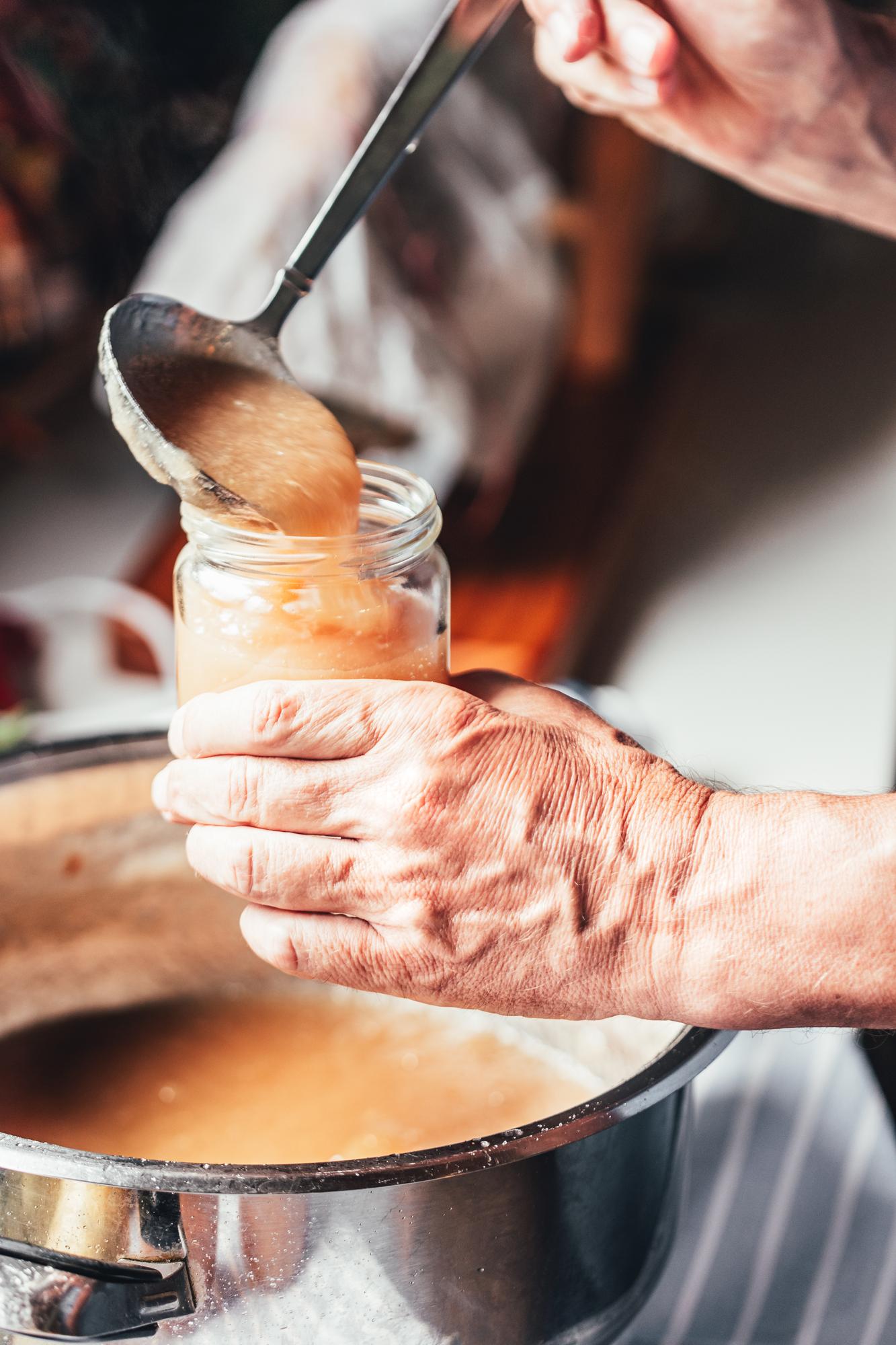 Close-up of hands finishing sauce