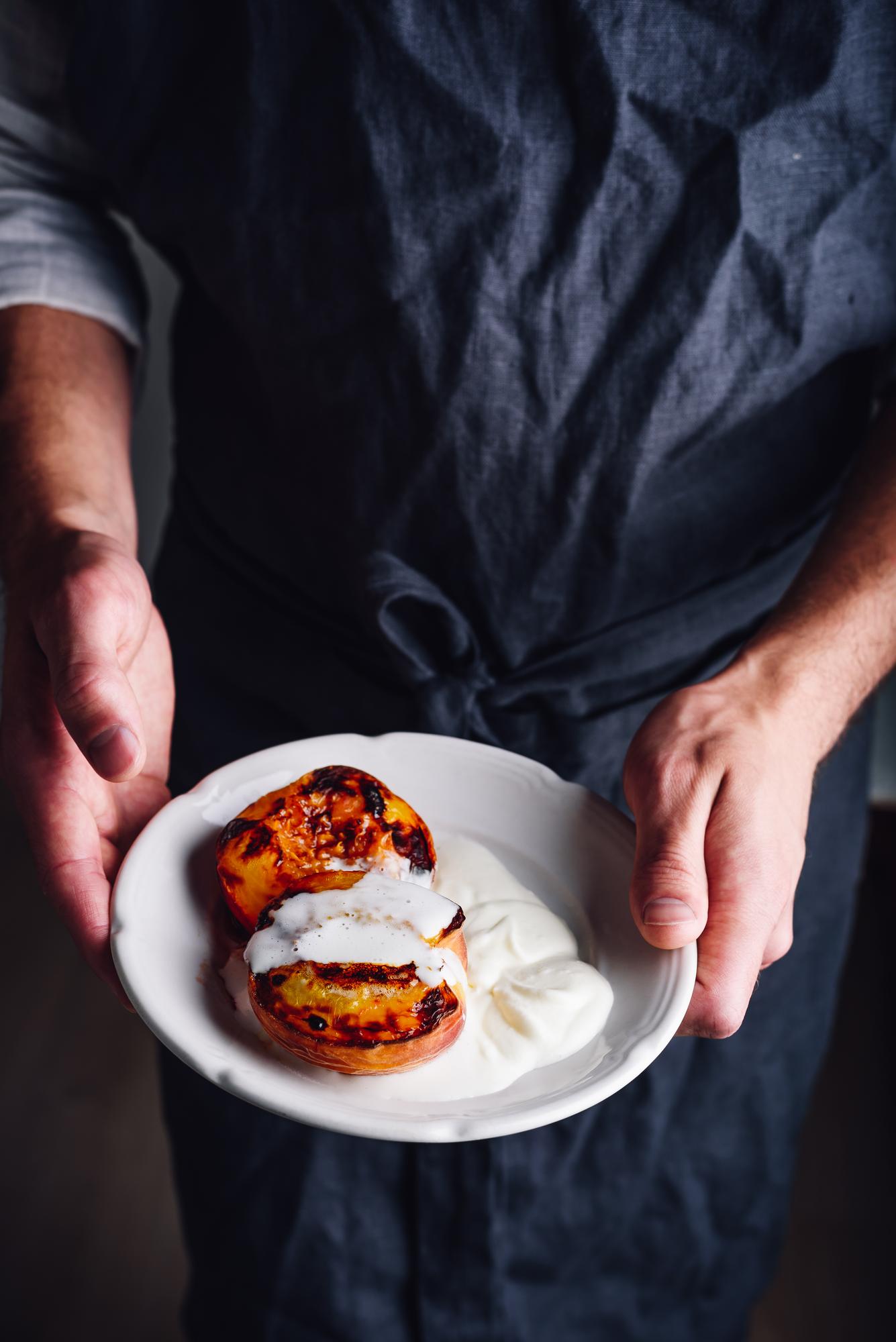 Chef preparing plated dish in calm studio